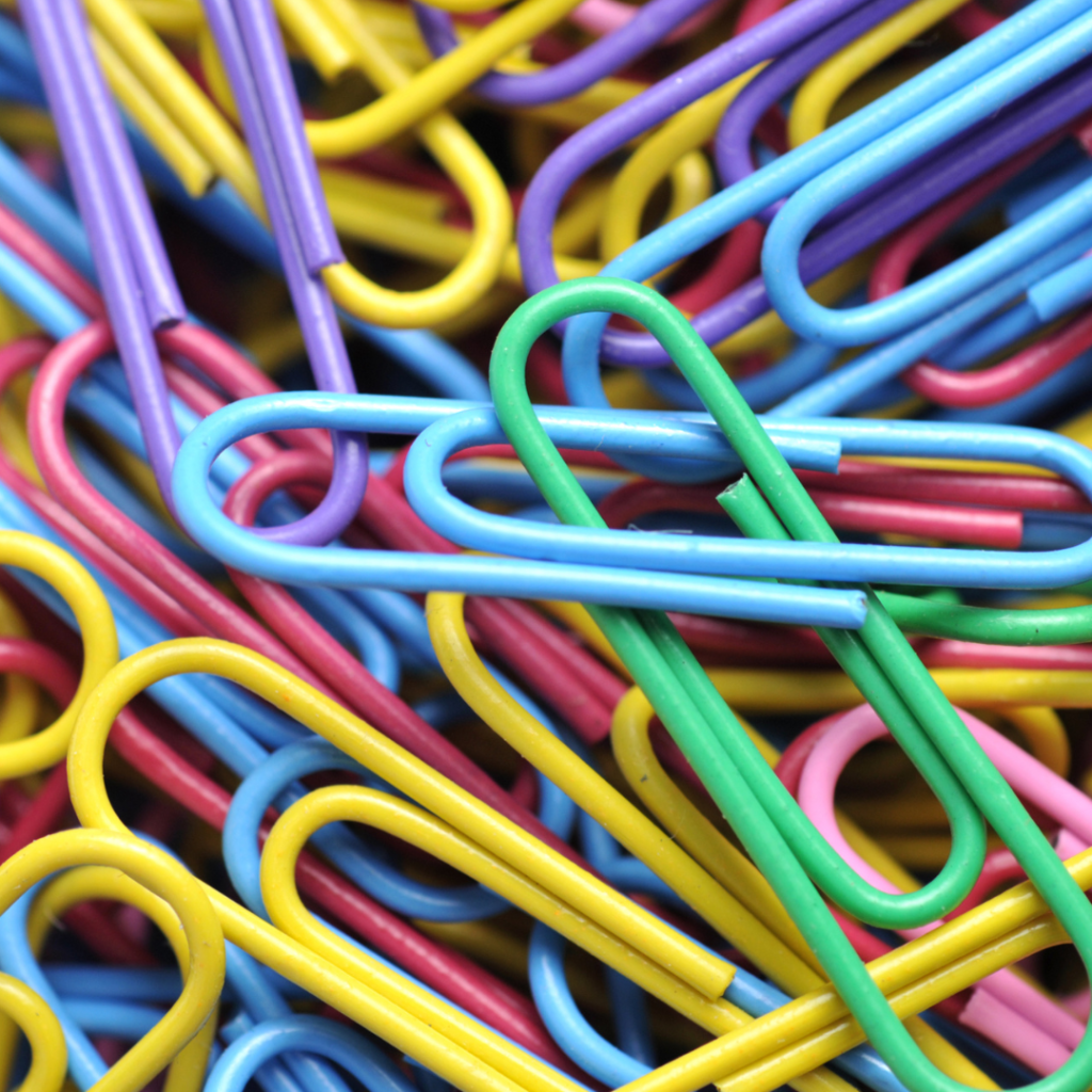 Colorful paperclips symbolizing unity, diversity, and resilience—representing the collective strength behind the paperclip symbol explored in Carol Odell’s essay “Paperclip Resistance.”