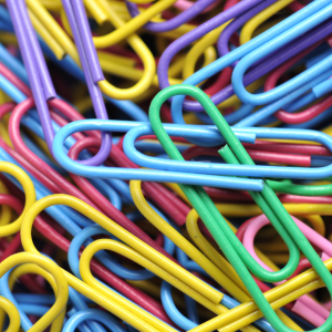 Colorful paperclips symbolizing unity, diversity, and resilience—representing the collective strength behind the paperclip symbol explored in Carol Odell’s essay “Paperclip Resistance.”